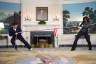 First Lady Michelle Obama participates in a tug of war with Jimmy Fallon in the Diplomatic Reception Room of the White House during a “Late Night with Jimmy Fallon” taping.