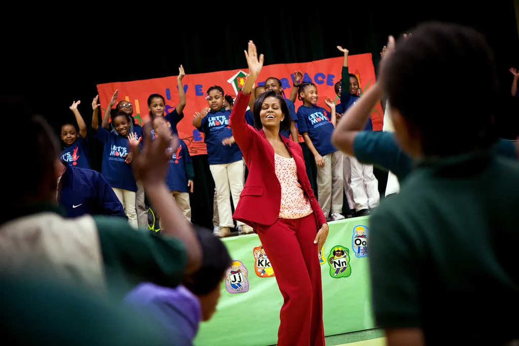 First Lady Michelle Obama exercises with students and Olympic athletes during a Let's Move event.