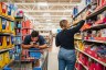 Customers shop for school supplies at a Walmart store.