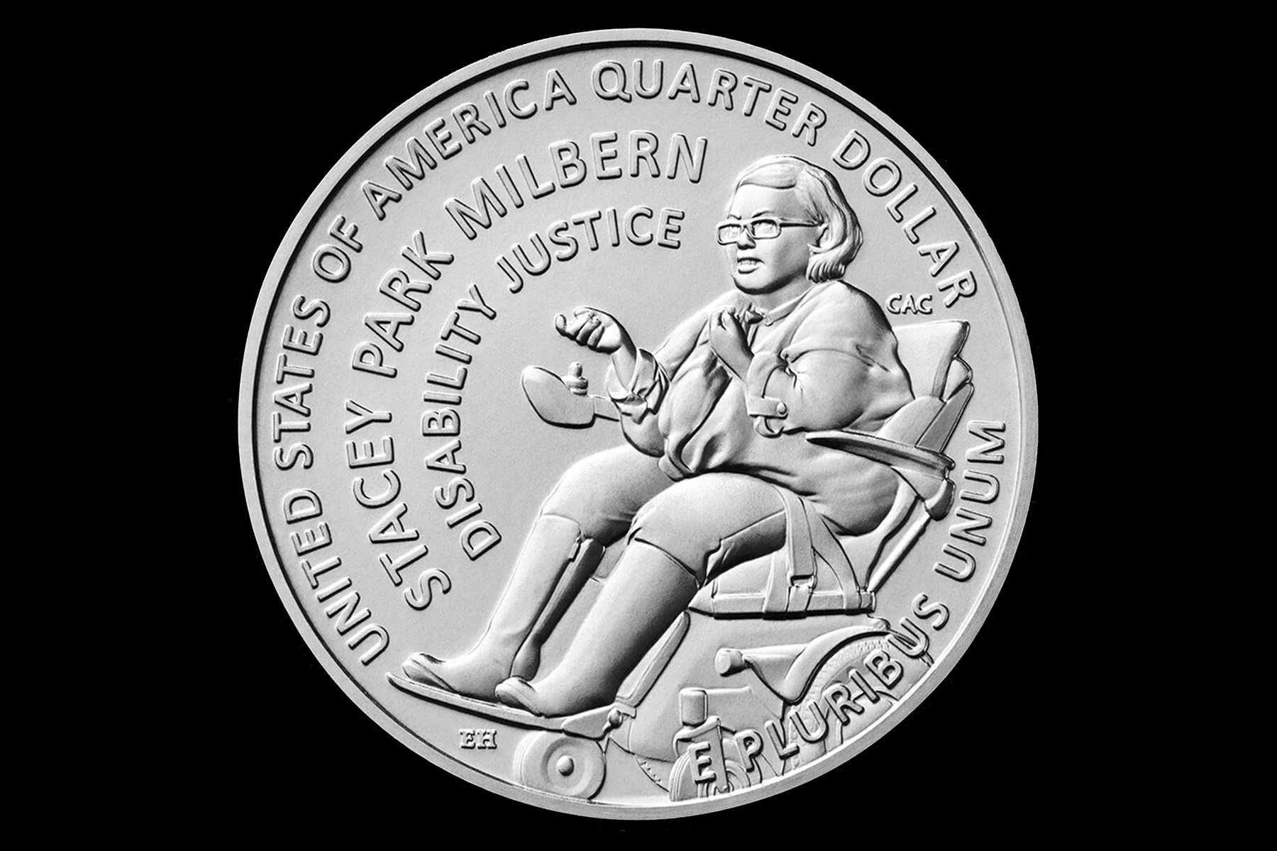 A U.S. quarter featuring Stacey Park Milbern seated in her wheelchair, wearing glasses, with the inscriptions “Stacey Park Milbern,” “Disability Justice,” and “United States of America Quarter Dollar.”