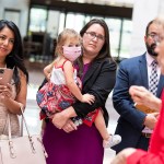 Rep. Erin Zwiener and her daughter, Lark, listen to Sen. Elizabeth Warren address Democratic members of the Texas Legislature in Washington, D.C.