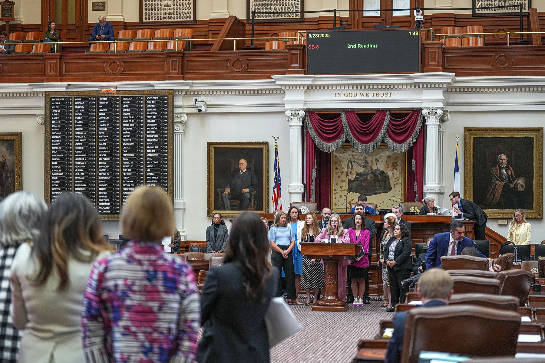 Backed by other supporters, Texas Rep. Angelia Orr reads Senate Bill 8, the bathroom bill, in the House chamber at the Texas Capitol.