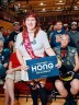Ashley Mertes stands in front of Hong supporters with a sign that says Francesca Hong for Governor