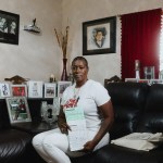 Crystal Mason holds Texas Voter Registration Application forms in her home in Fort Worth