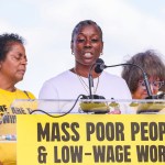 A woman speaks at a podium.