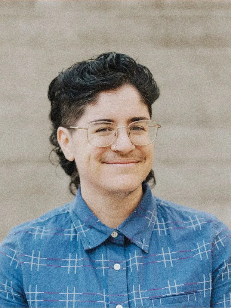 A portrait of Sarcone in a blue shirt